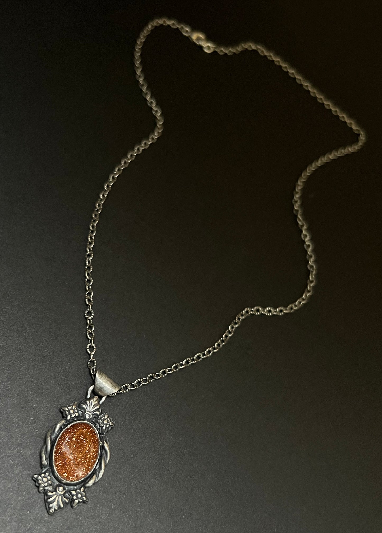 Necklace with a pendant on a dark background