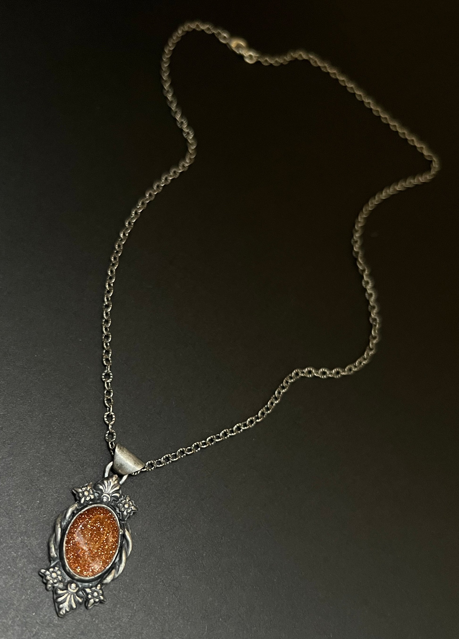 Necklace with a pendant on a dark background